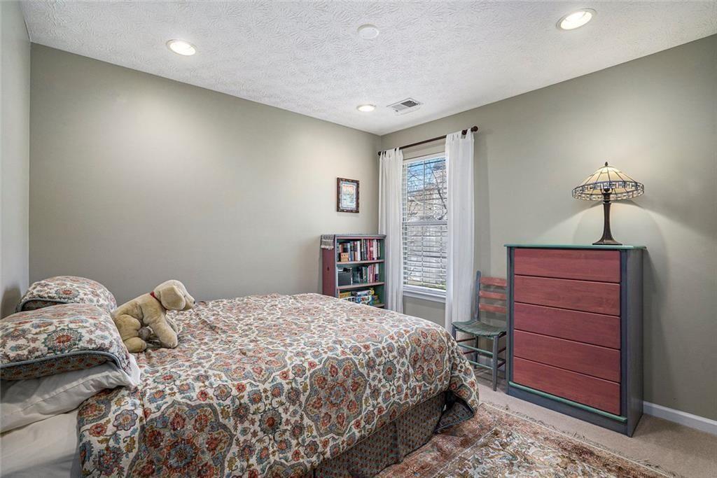 73 Whitlock Square Southwest Marietta, GA 30064 - Photo 20 of 35 a bedroom with a bed and a closet