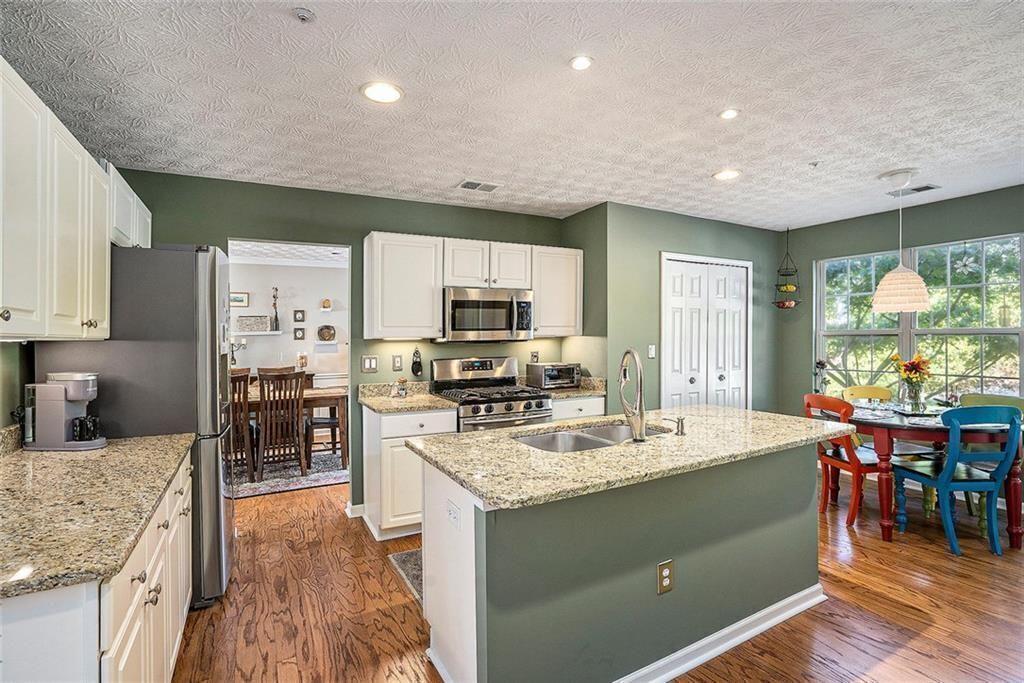73 Whitlock Square Southwest Marietta, GA 30064 - Photo 2 of 35 a kitchen with a sink stove and cabinets