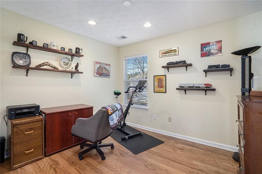 73 Whitlock Square Southwest Marietta, GA 30064 - Photo 21 of 35 a view of a workspace with furniture and wooden floor