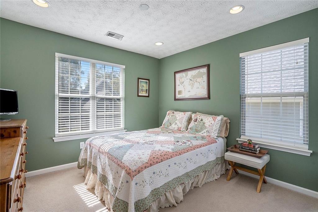 73 Whitlock Square Southwest Marietta, GA 30064 - Photo 22 of 35 a bedroom with a bed and a window