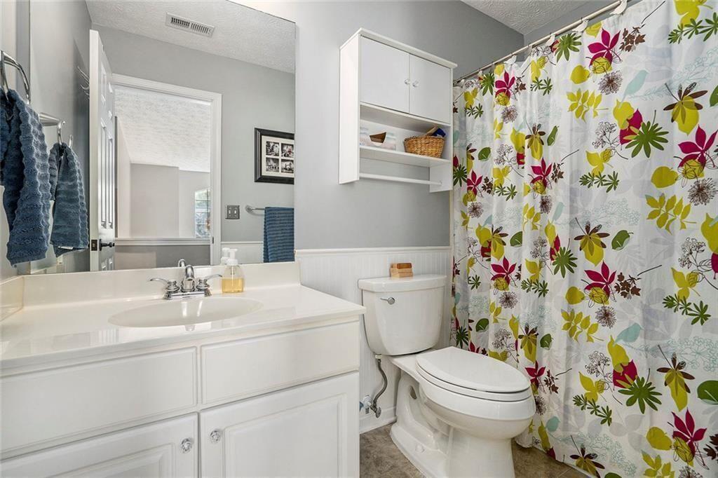 73 Whitlock Square Southwest Marietta, GA 30064 - Photo 23 of 35 a bathroom with a sink toilet and vanity
