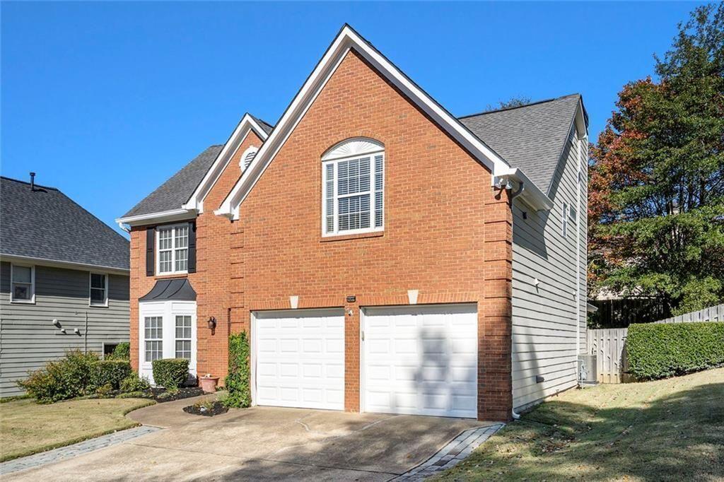 73 Whitlock Square Southwest Marietta, GA 30064 - Photo 31 of 35 a front view of a house with a yard