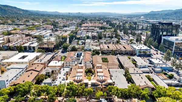 an aerial view of residential houses with outdoor space