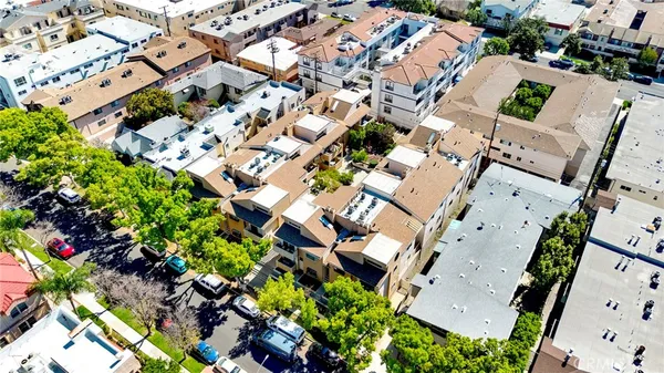 an aerial view of residential houses with outdoor space