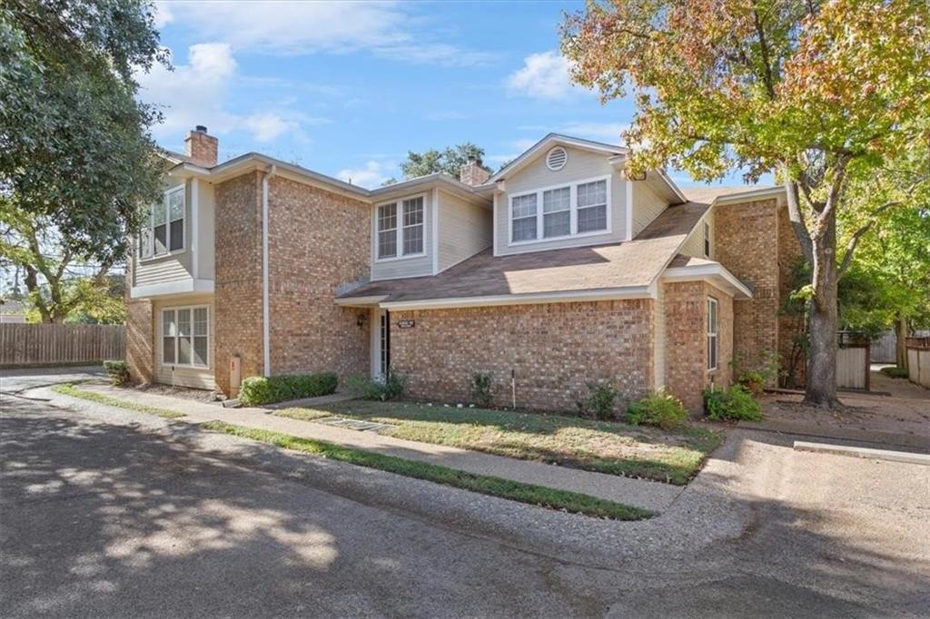 2306 Melissa Drive Waco, TX 76708 - Photo 2 of 22 a view of a brick house next to a yard with large trees