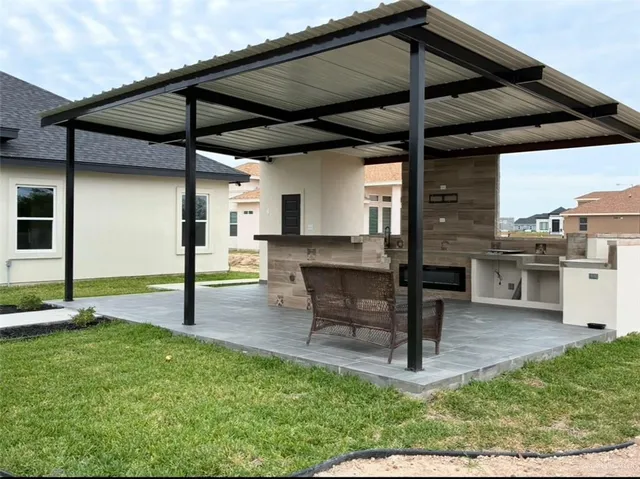 a patio with table and chairs