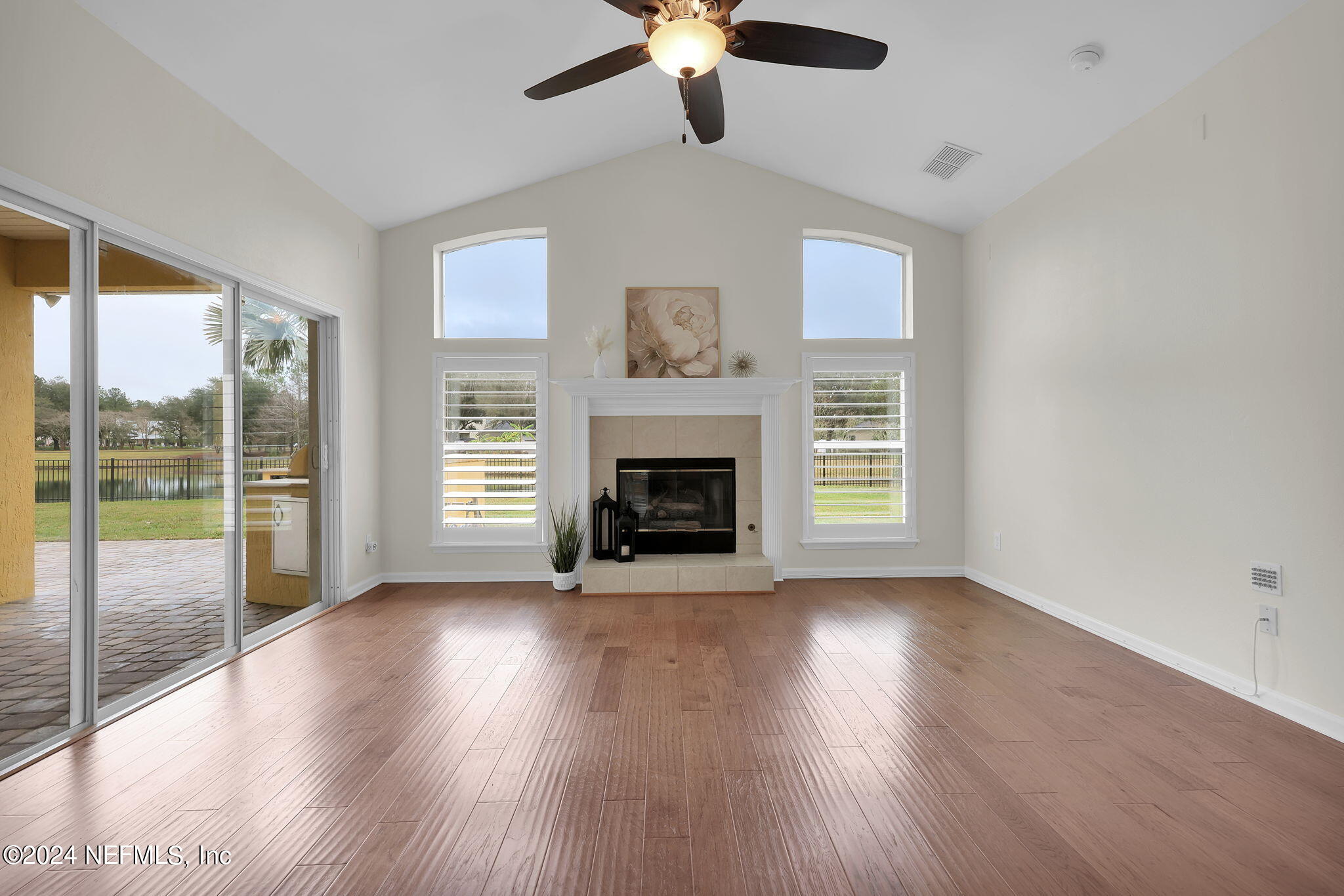 2044 River's Own Road St. Augustine, FL 32092 - Photo 15 of 48 a view of an empty room with wooden floor and a window