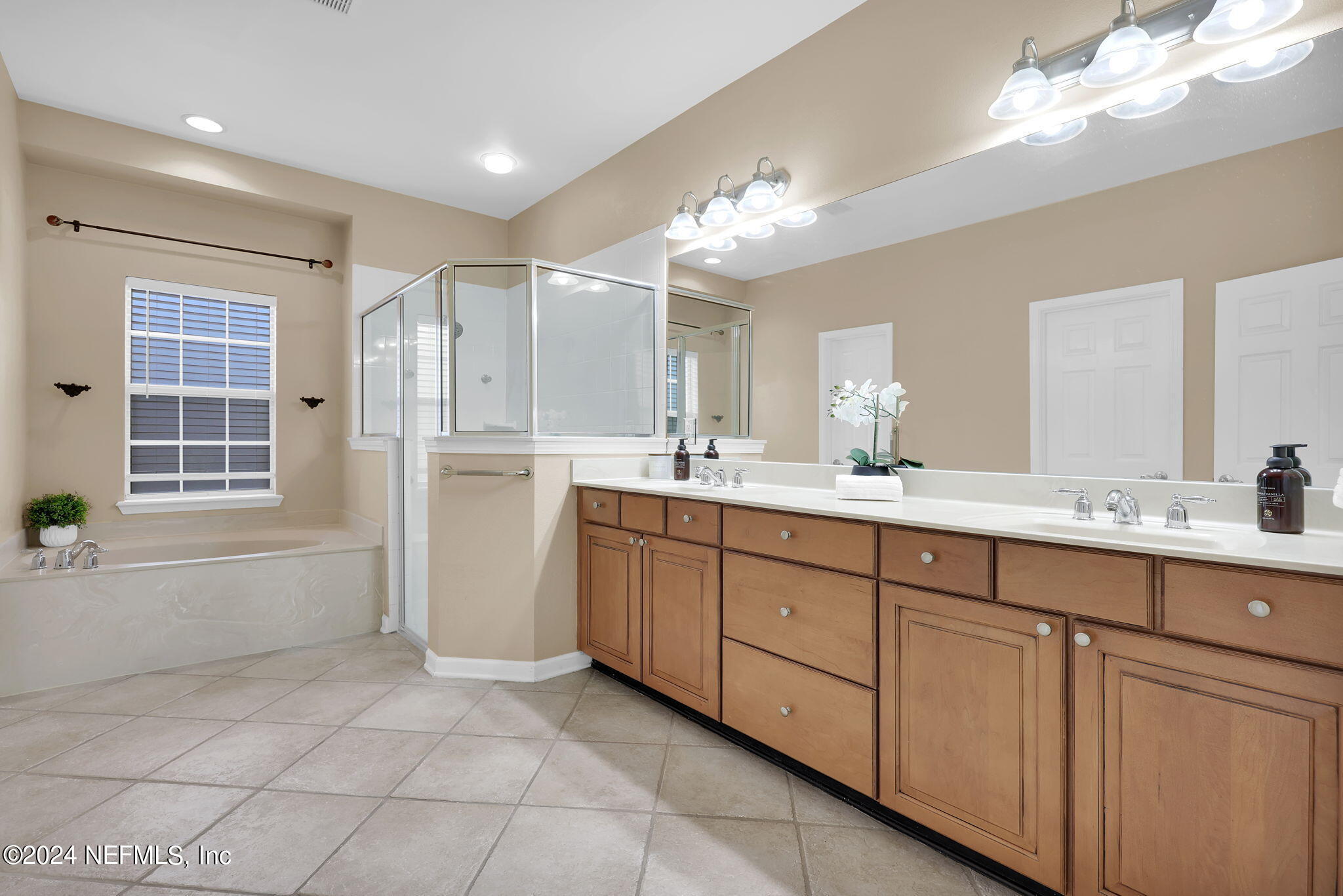 2044 River's Own Road St. Augustine, FL 32092 - Photo 18 of 48 a spacious bathroom with a granite countertop sink a toilet a mirror and shower