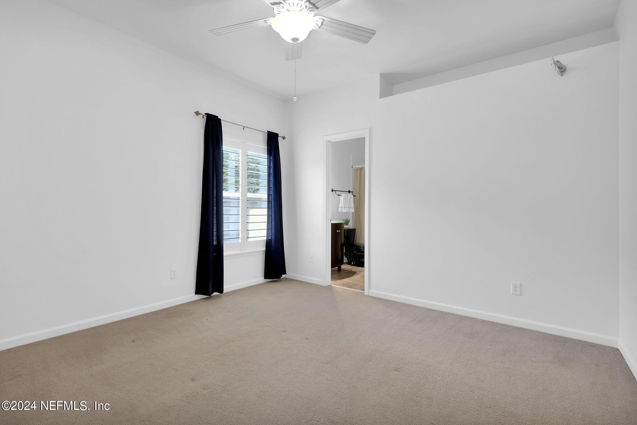 2044 River's Own Road St. Augustine, FL 32092 - Photo 23 of 48 a view of an empty room with a window