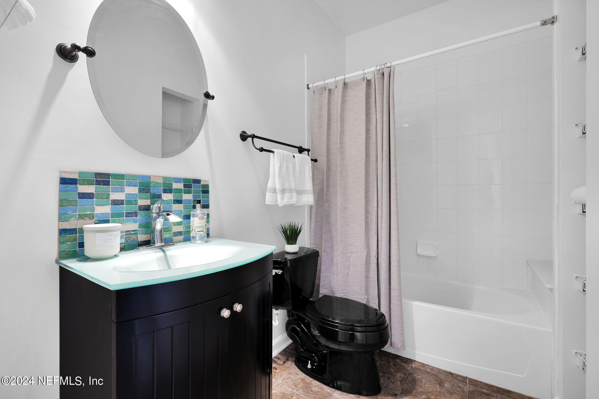 2044 River's Own Road St. Augustine, FL 32092 - Photo 24 of 48 a bathroom with a sink a toilet and shower