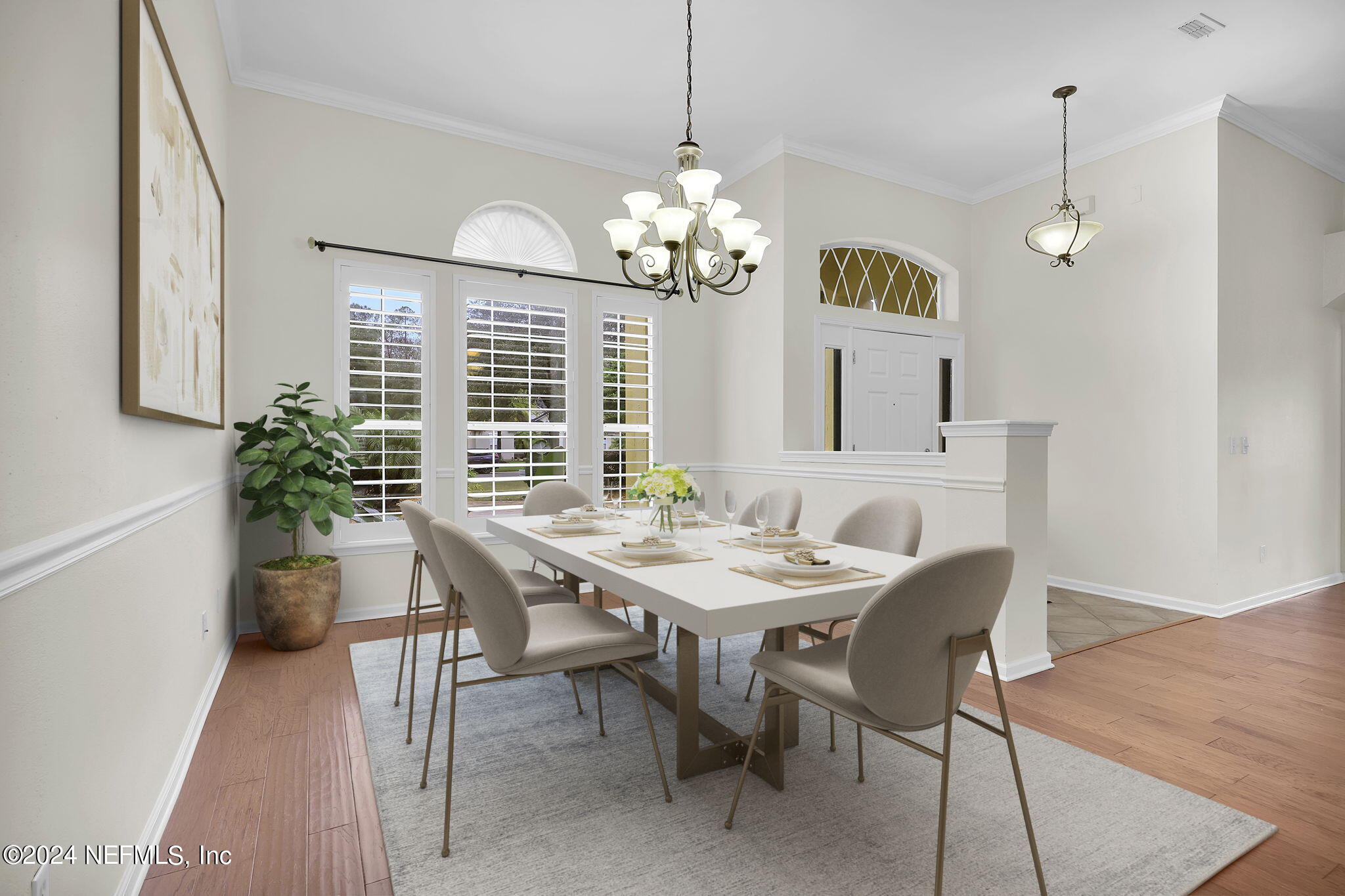 2044 River's Own Road St. Augustine, FL 32092 - Photo 3 of 48 a view of a dining room with furniture a chandelier and wooden floor