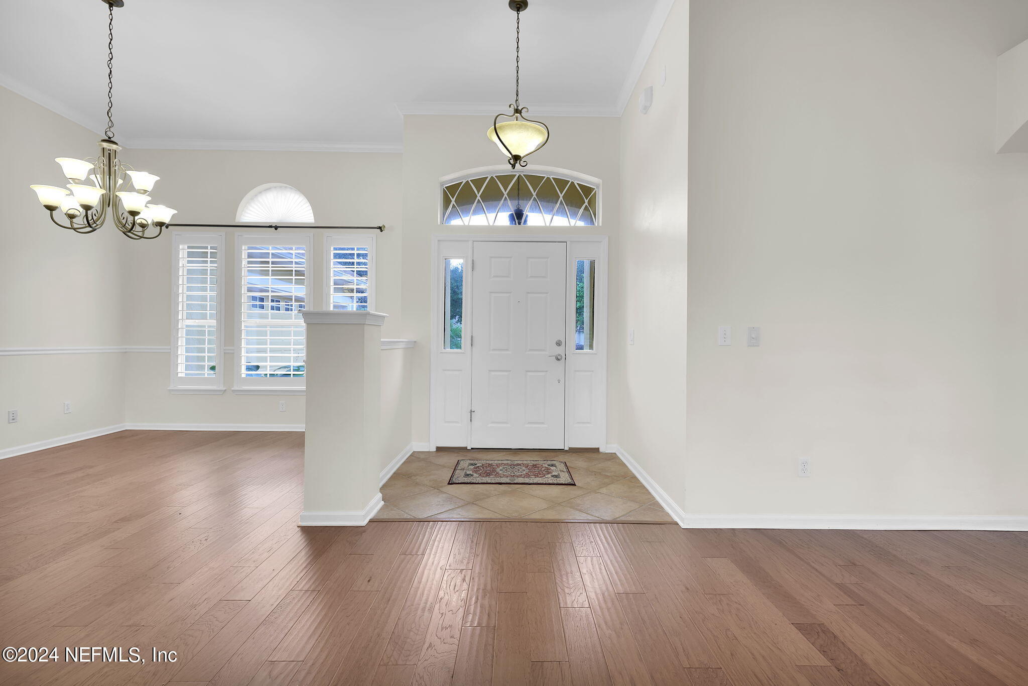2044 River's Own Road St. Augustine, FL 32092 - Photo 8 of 48 a view of a chandelier fan and wooden floor