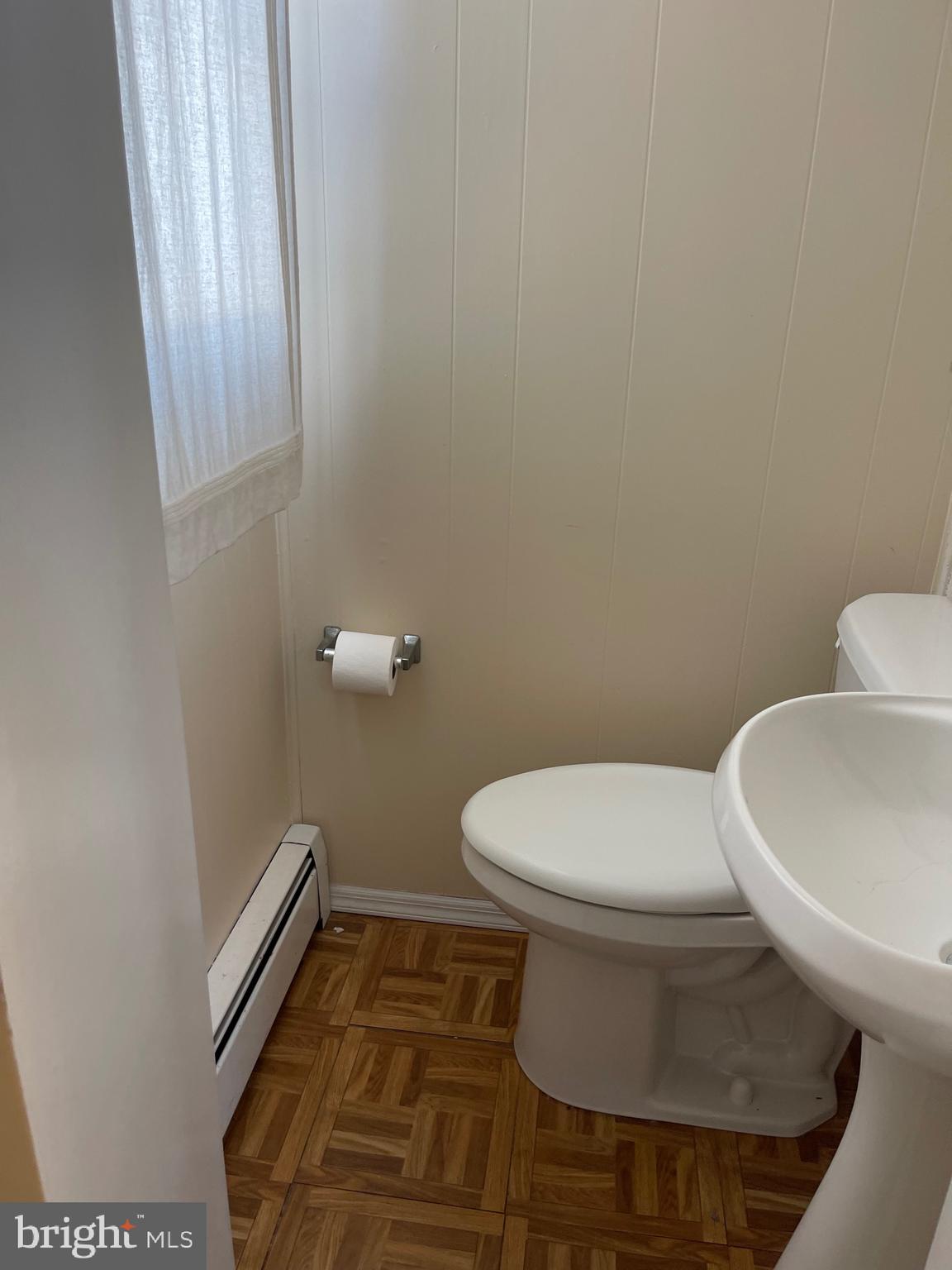 322 McKinley Avenue Pitman, NJ 08071 - Photo 17 of 44 a white toilet sitting next to a white sink