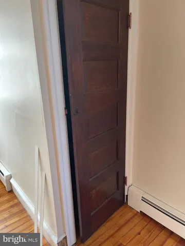 an empty room with wooden floor