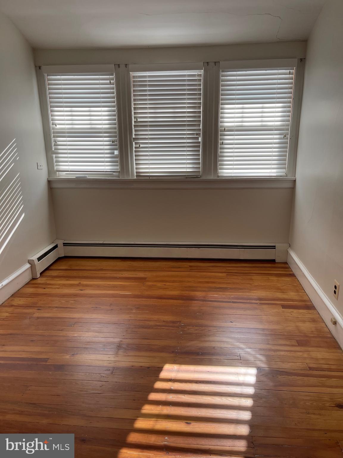 322 McKinley Avenue Pitman, NJ 08071 - Photo 27 of 44 a view of a room with wooden floor and window
