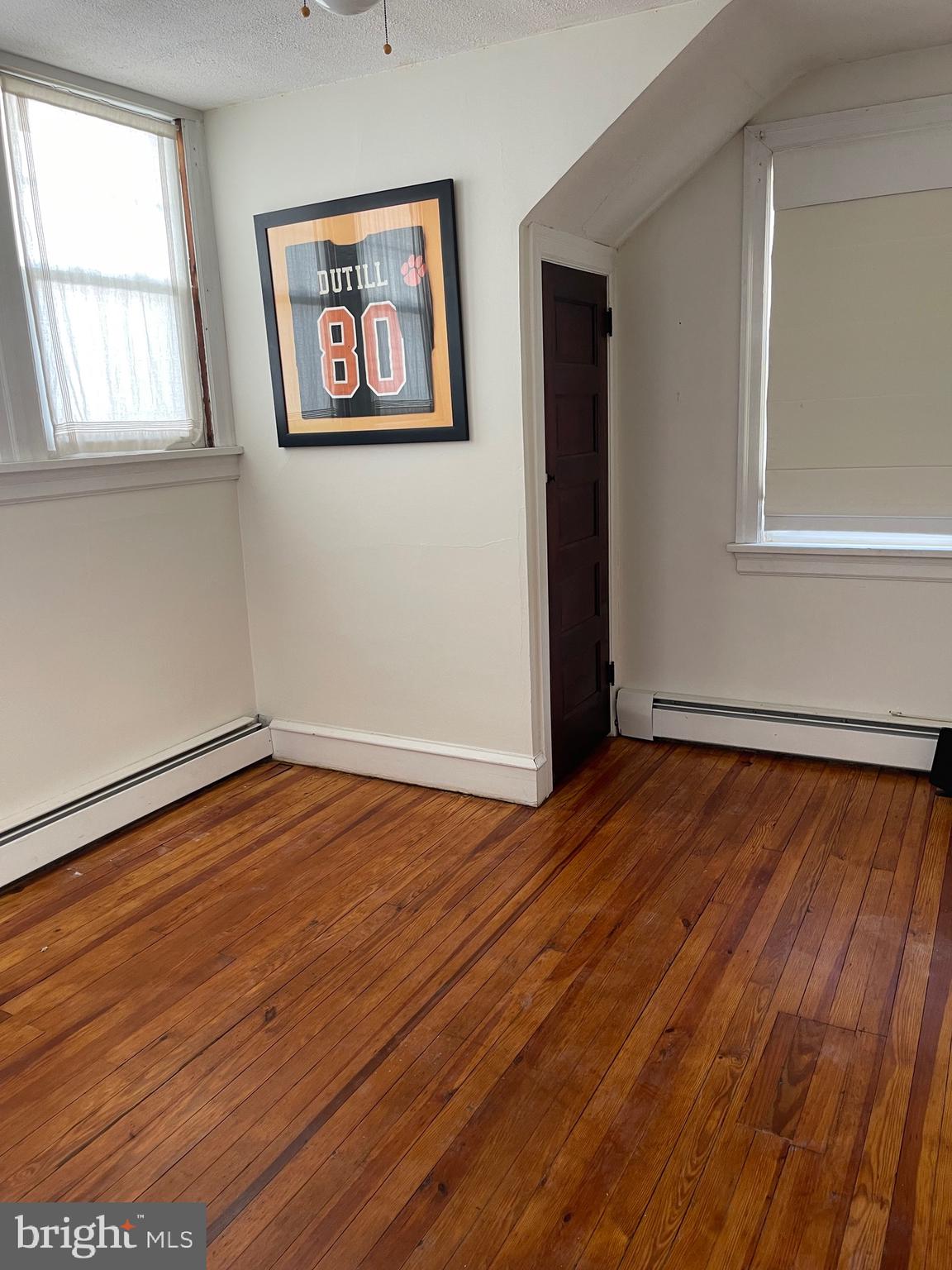 322 McKinley Avenue Pitman, NJ 08071 - Photo 28 of 44 an empty room with wooden floor and windows