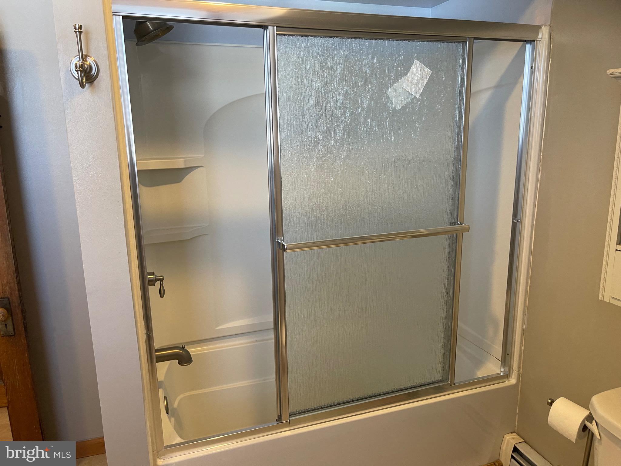 322 McKinley Avenue Pitman, NJ 08071 - Photo 34 of 44 a bathroom with a glass shower door