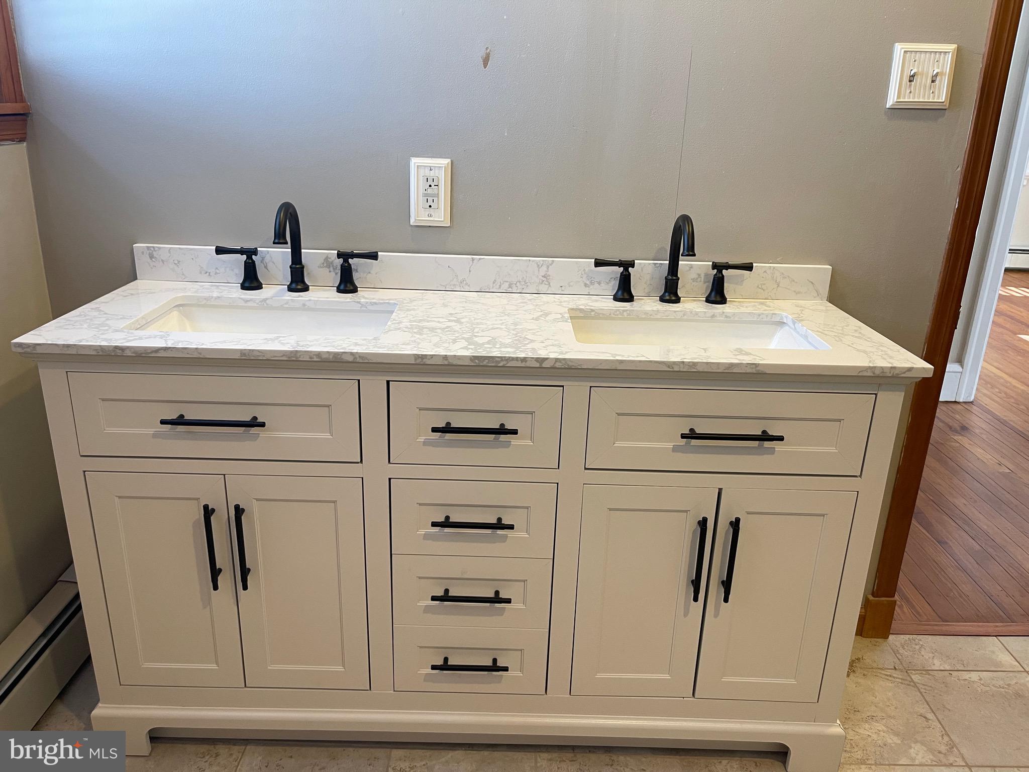322 McKinley Avenue Pitman, NJ 08071 - Photo 35 of 44 a bathroom with a sink and a mirror