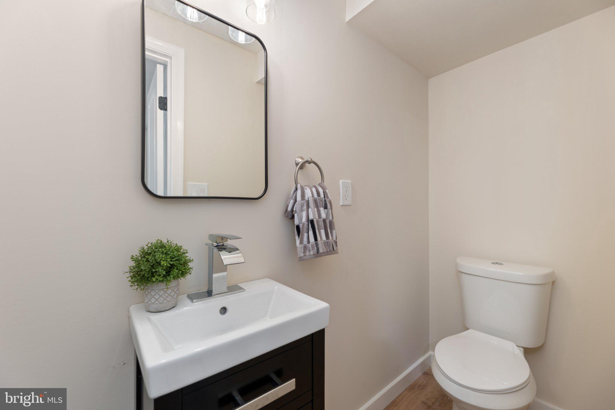 3215 Edgewood Road Kensington, MD 20895 - Photo 20 of 37 Sleek and modern powder room design.
