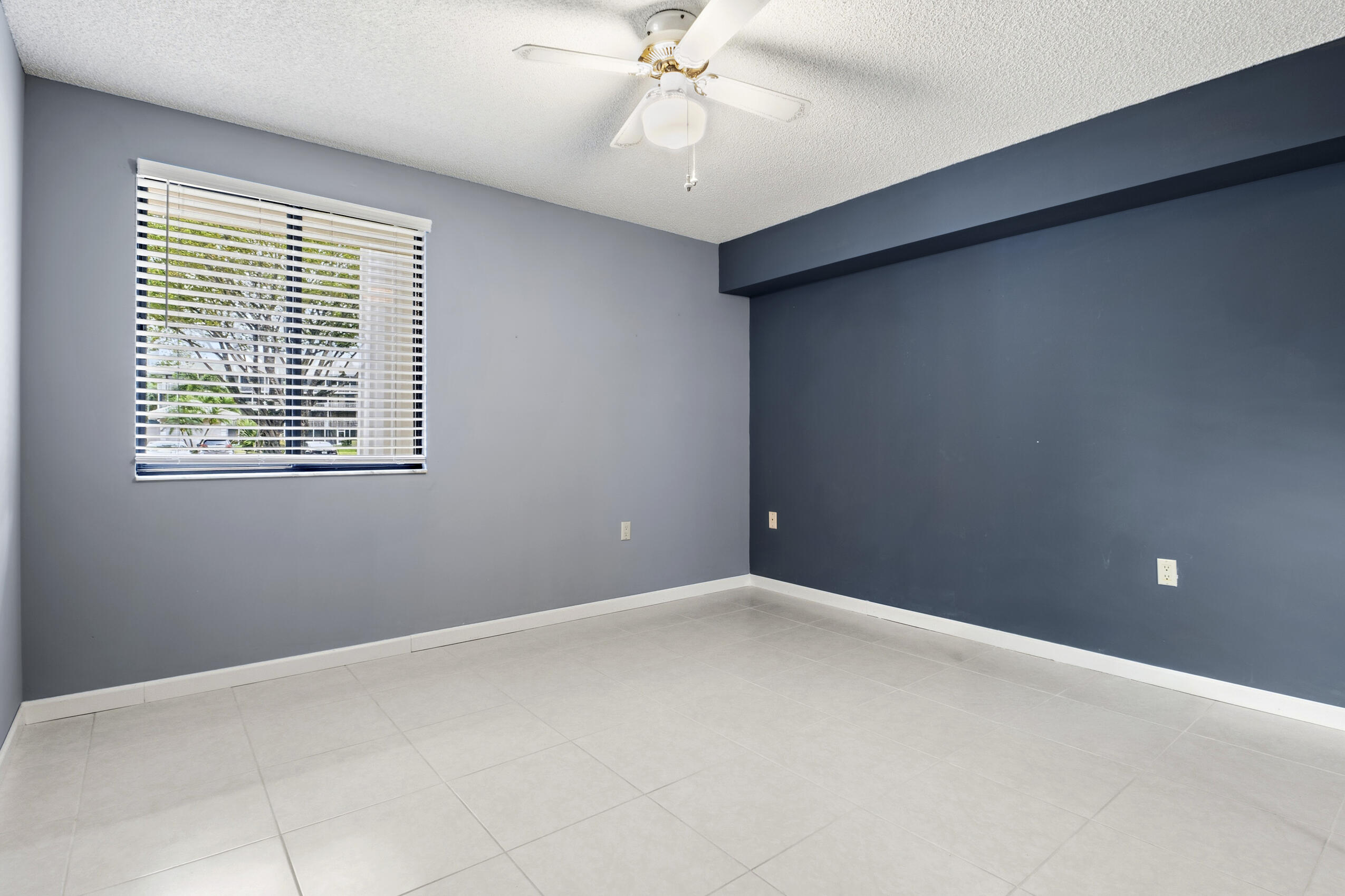 6145 Balboa Circle, Unit 103 Boca Raton, FL 33433 - Photo 19 of 31 a view of an empty room with a window