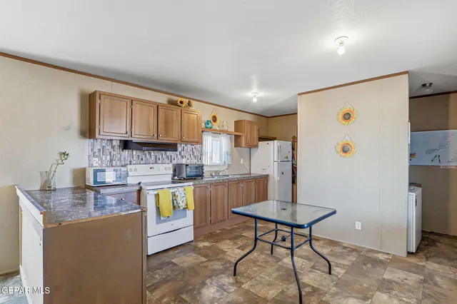 a room with a table and chairs