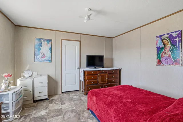 a bathroom with a granite countertop sink a toilet and shower curtain
