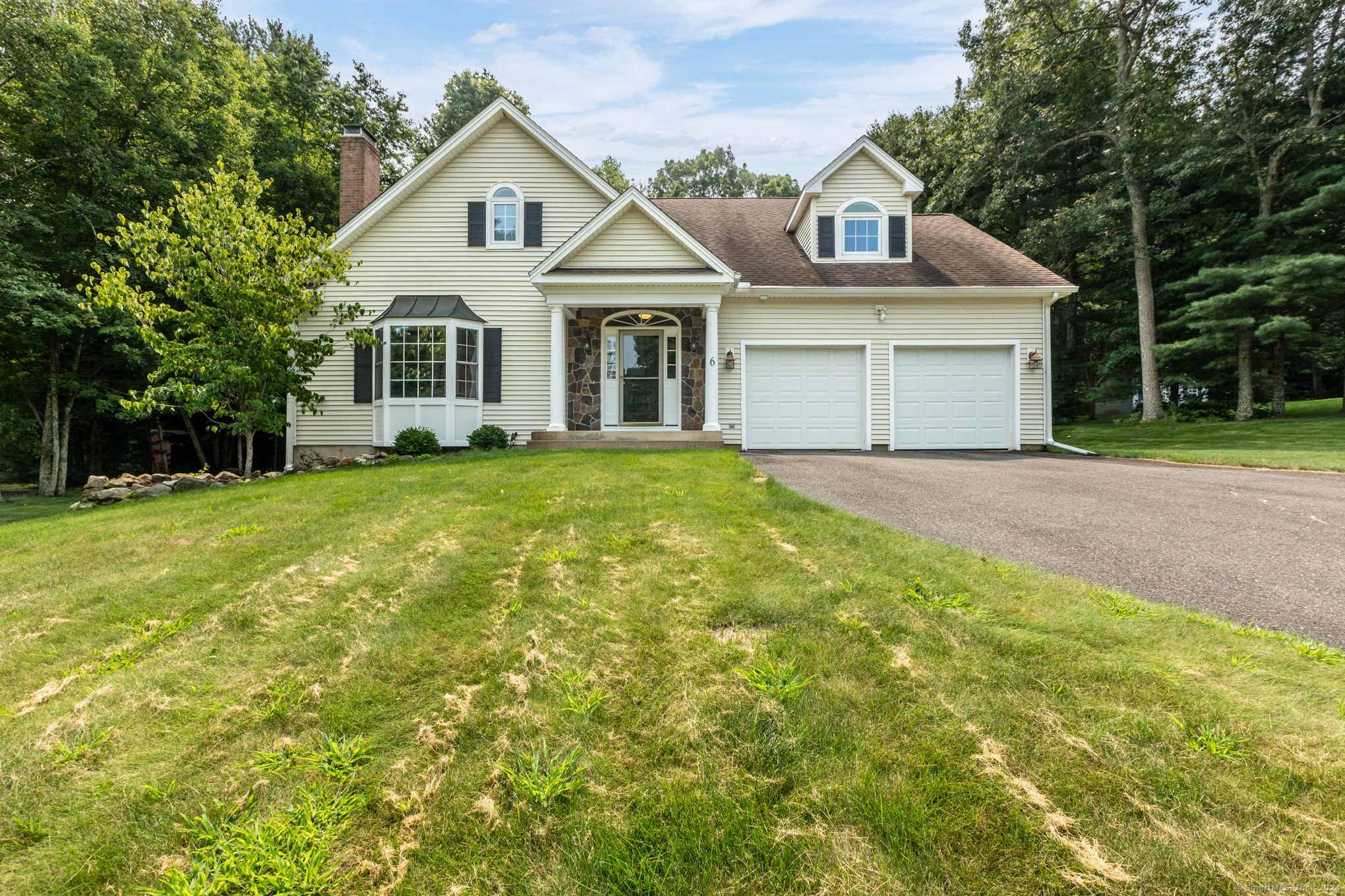 6 Boulder Ridge Drive Ellington, CT 06029 - Photo 1 of 1 a front view of a house with a yard and garage