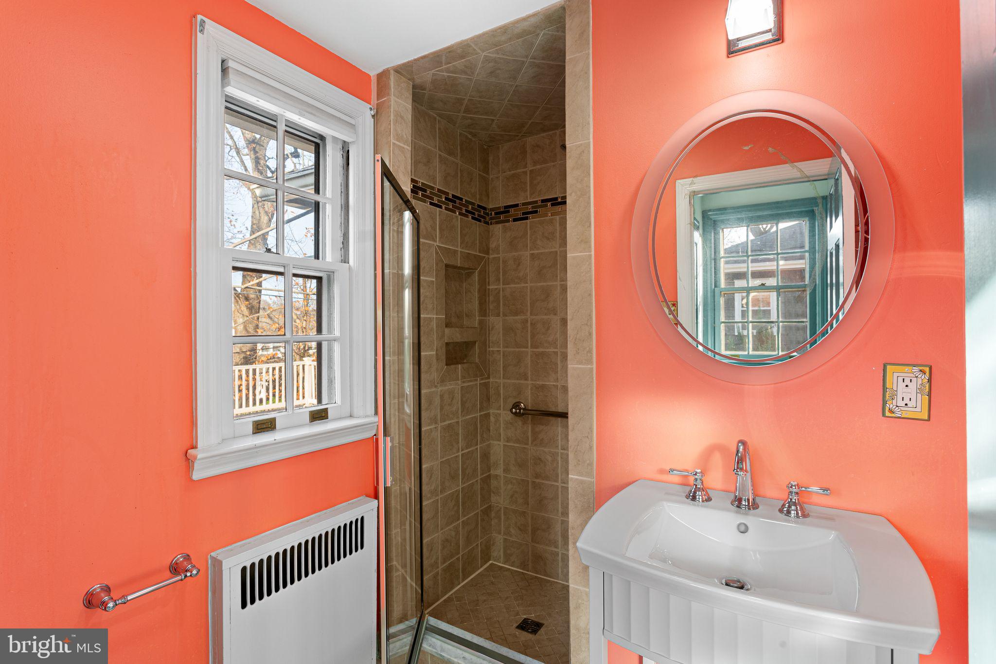 35 Colonial Ridge Drive Haddonfield, NJ 08033 - Photo 13 of 17 a bathroom with a sink a mirror and a window
