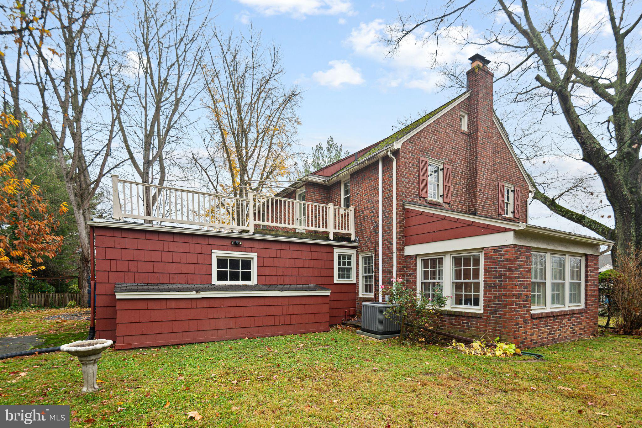 35 Colonial Ridge Drive Haddonfield, NJ 08033 - Photo 15 of 17 a front view of a house with a garden