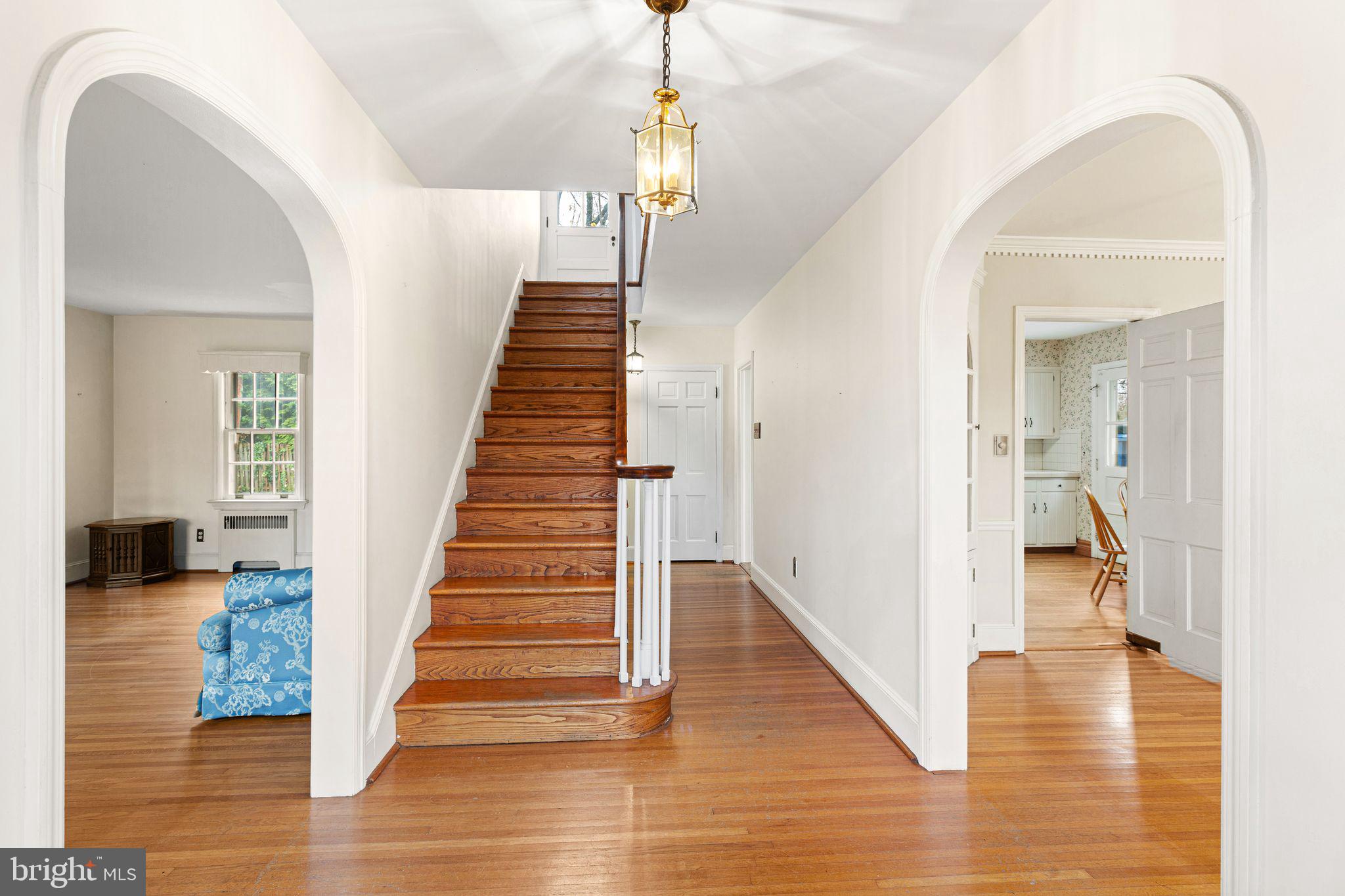 35 Colonial Ridge Drive Haddonfield, NJ 08033 - Photo 2 of 17 a view of a hallway view with wooden floor and staircase