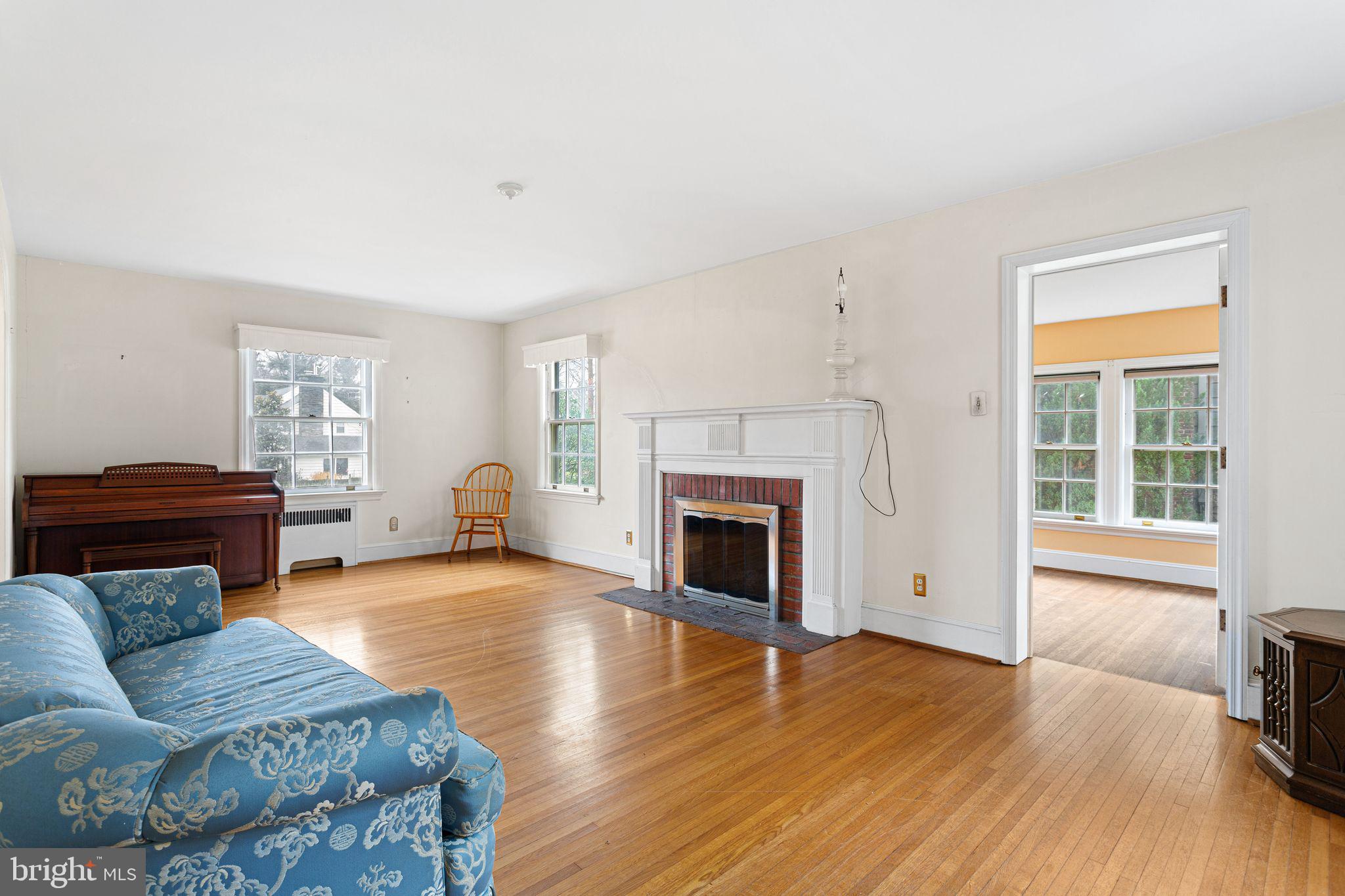 35 Colonial Ridge Drive Haddonfield, NJ 08033 - Photo 4 of 17 a living room with furniture and a fireplace