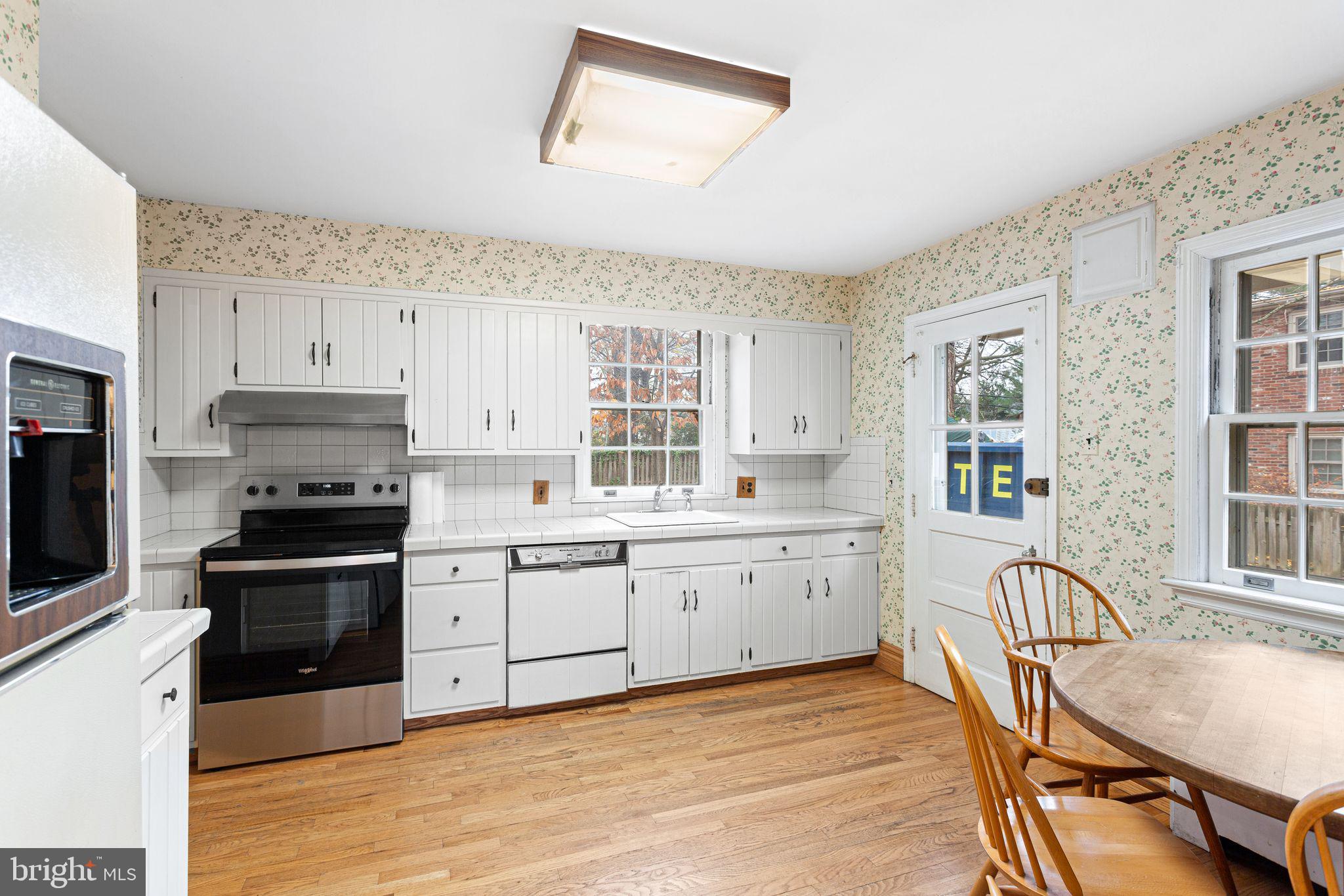 35 Colonial Ridge Drive Haddonfield, NJ 08033 - Photo 5 of 17 a kitchen with granite countertop a stove cabinets and wooden floor