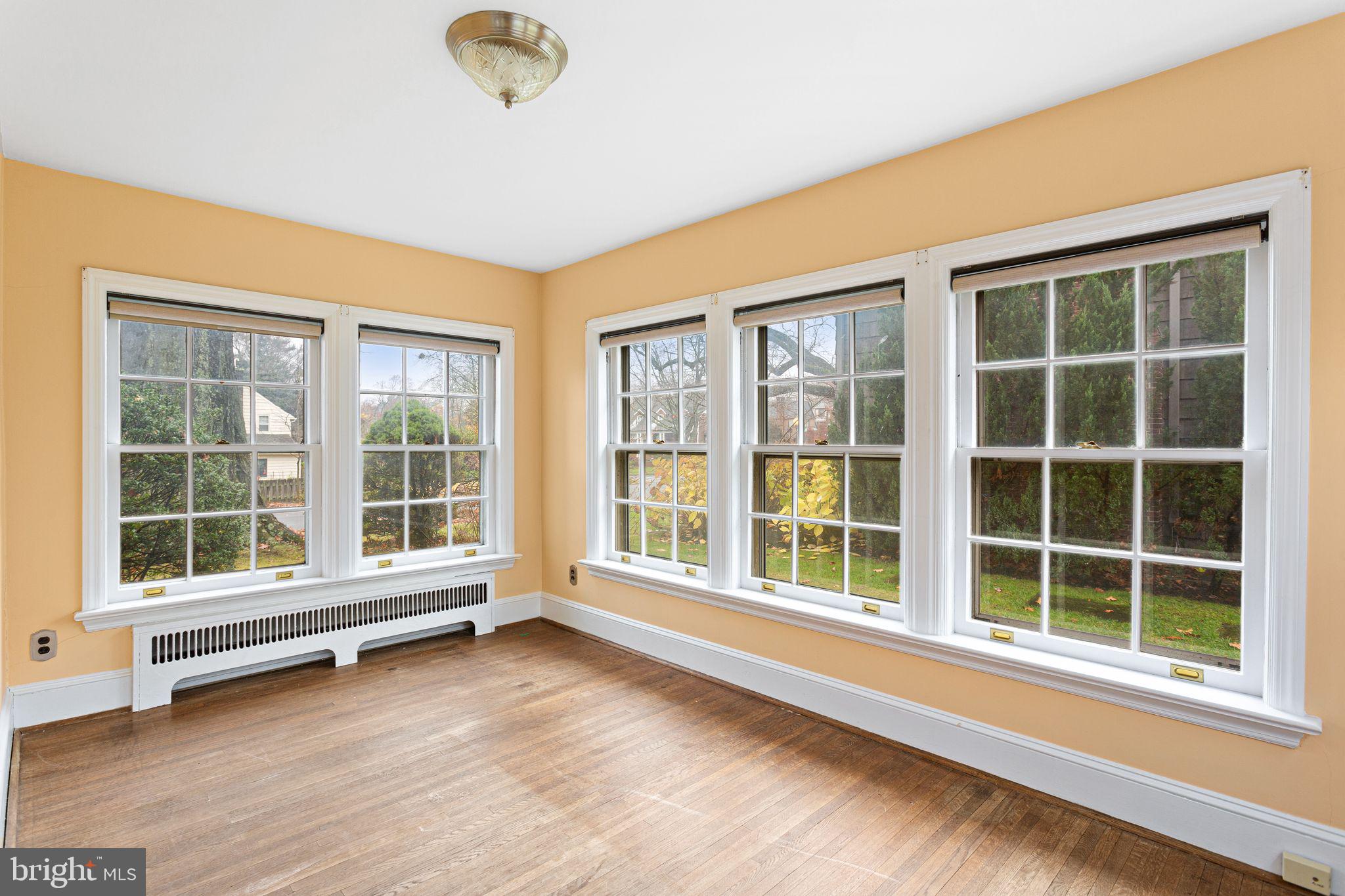 35 Colonial Ridge Drive Haddonfield, NJ 08033 - Photo 6 of 17 a view of an empty room with a window and wooden floor