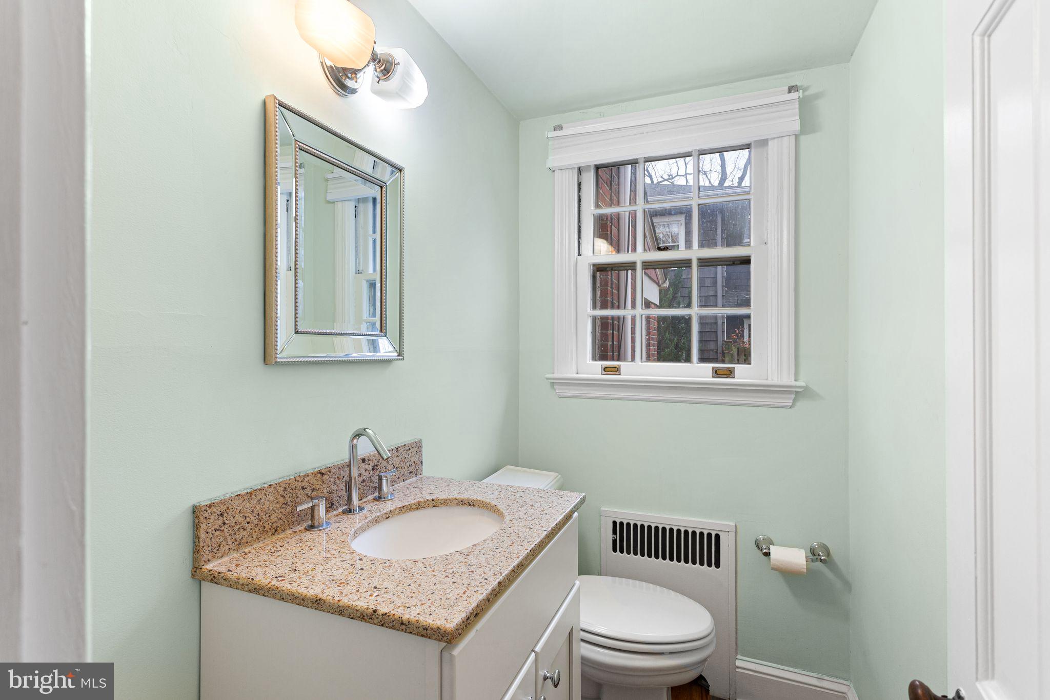 35 Colonial Ridge Drive Haddonfield, NJ 08033 - Photo 7 of 17 a bathroom with a granite countertop toilet a sink and mirror