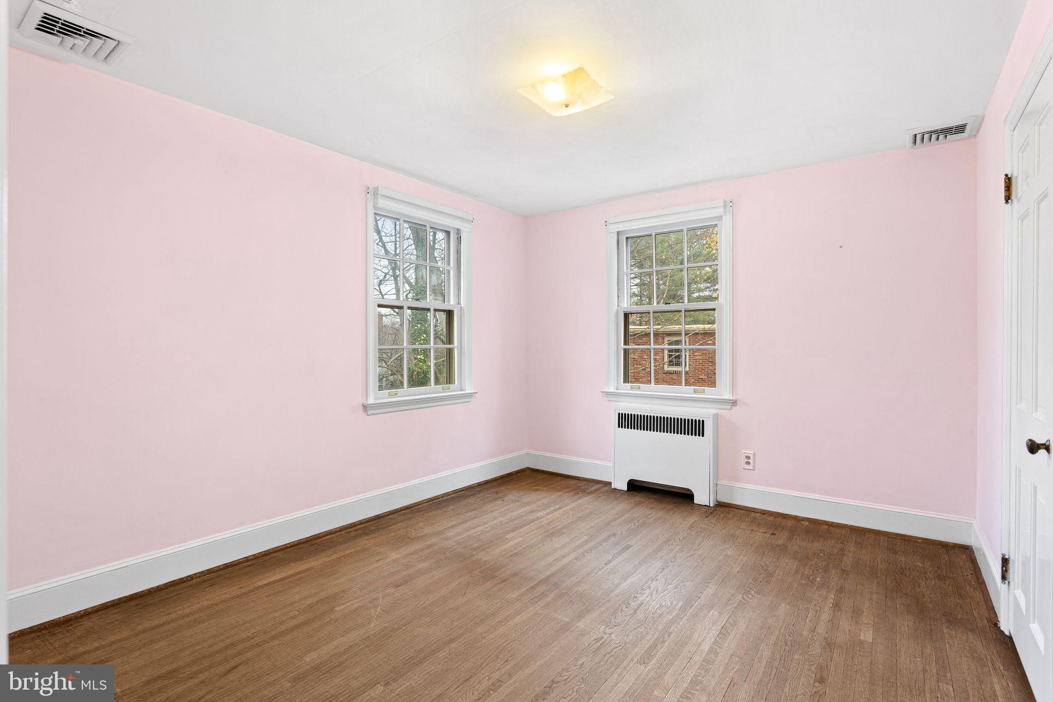 35 Colonial Ridge Drive Haddonfield, NJ 08033 - Photo 9 of 17 an empty room with wooden floor and windows