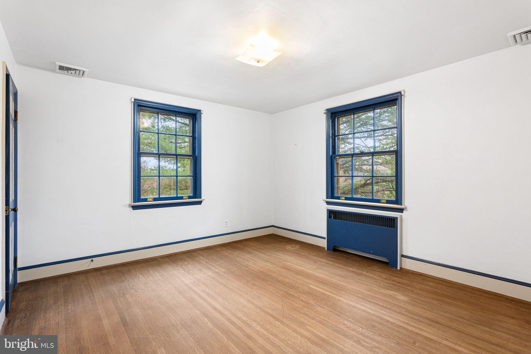 35 Colonial Ridge Drive Haddonfield, NJ 08033 - Photo 10 of 17 an empty room with wooden floor and windows