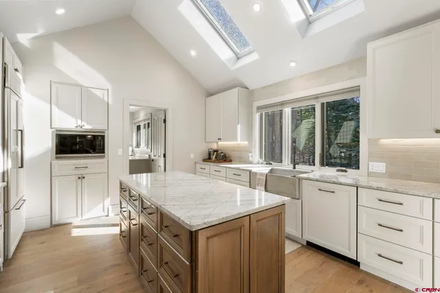 a kitchen with a stove a sink and a refrigerator