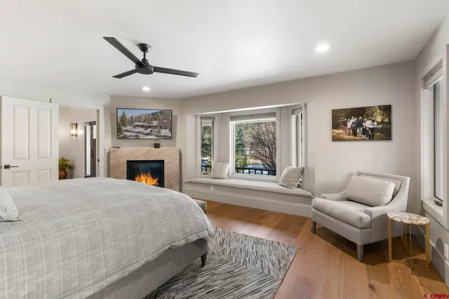 a spacious bedroom with a bed and a couch