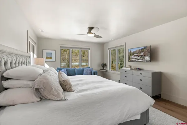 a bedroom with a large bed and a window