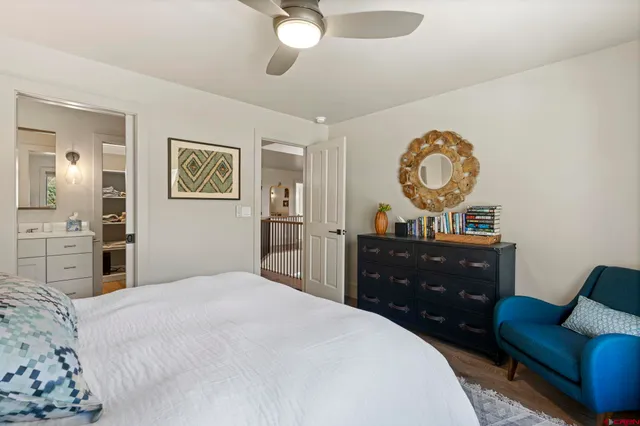a bedroom with a bed and cabinets