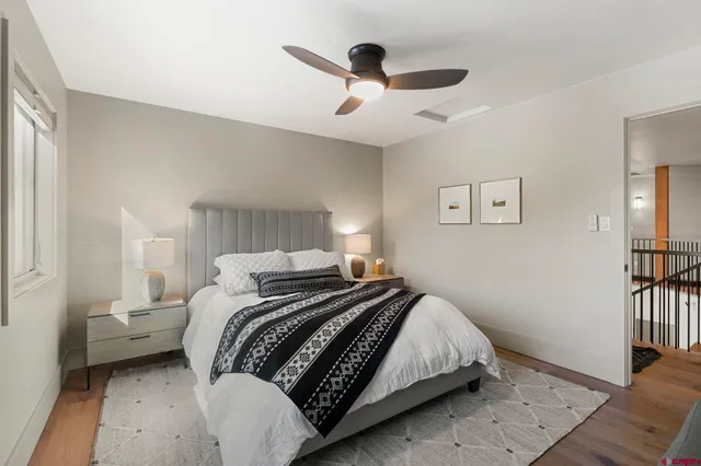 a bedroom with bed and a window