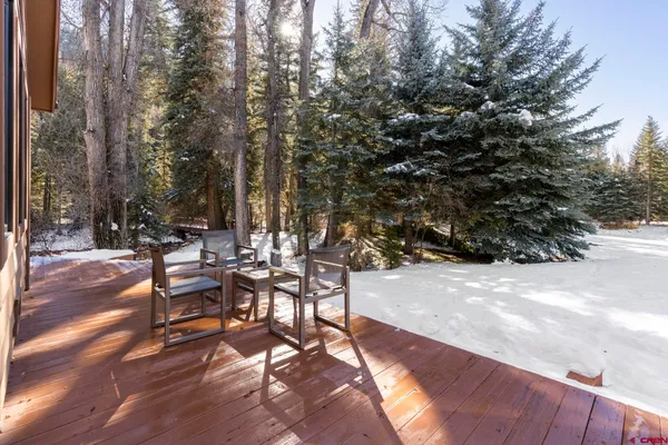 a view of a backyard with sitting area