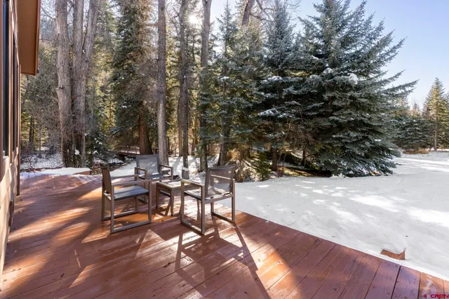 a view of a backyard with sitting area