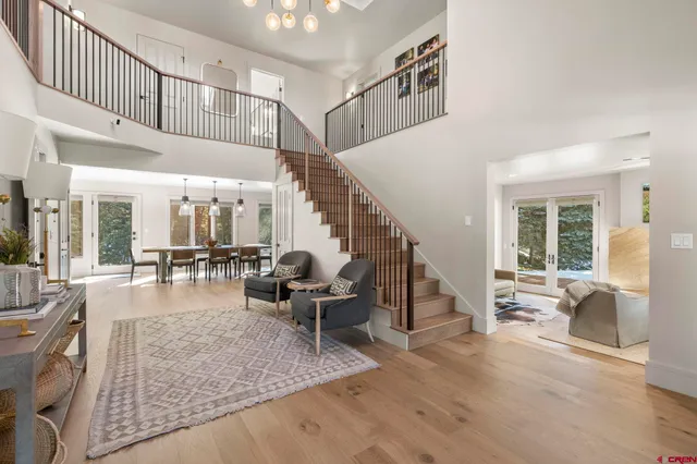 a very nice looking living room with a large window and furniture