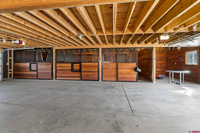 a view of an empty room with furniture