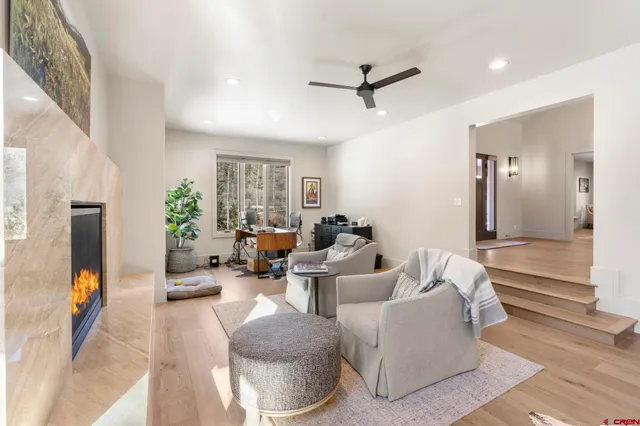a living room with furniture and a large window