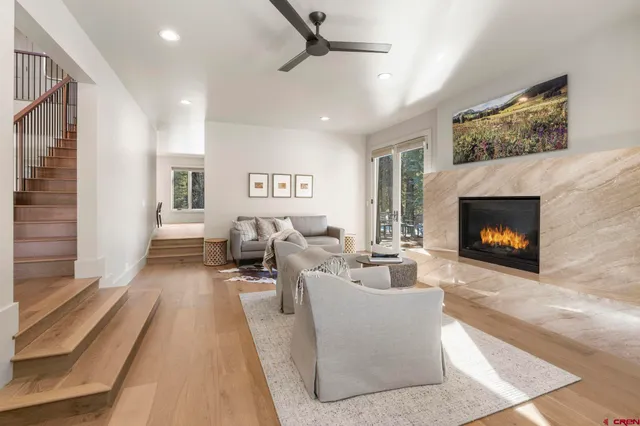 a living room with furniture and a fireplace
