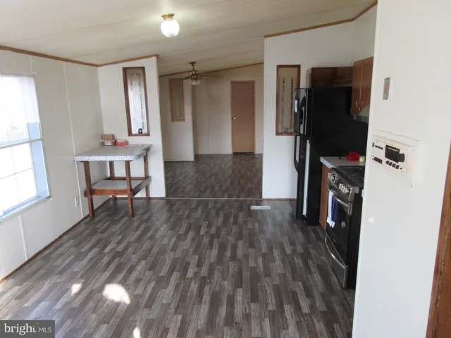 a view of a livingroom with furniture and wooden floor