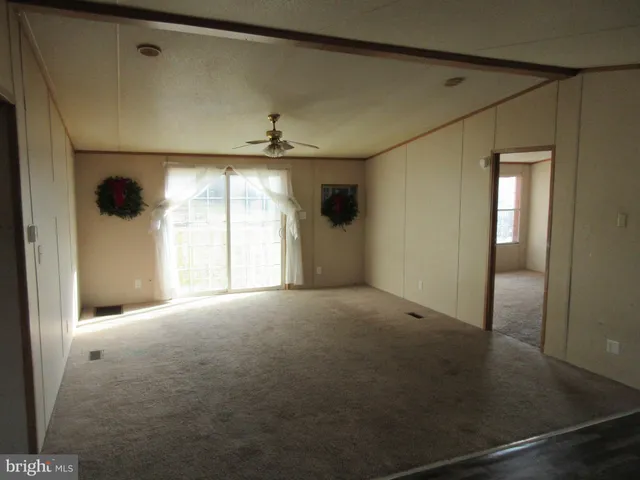 a view of empty room with windows