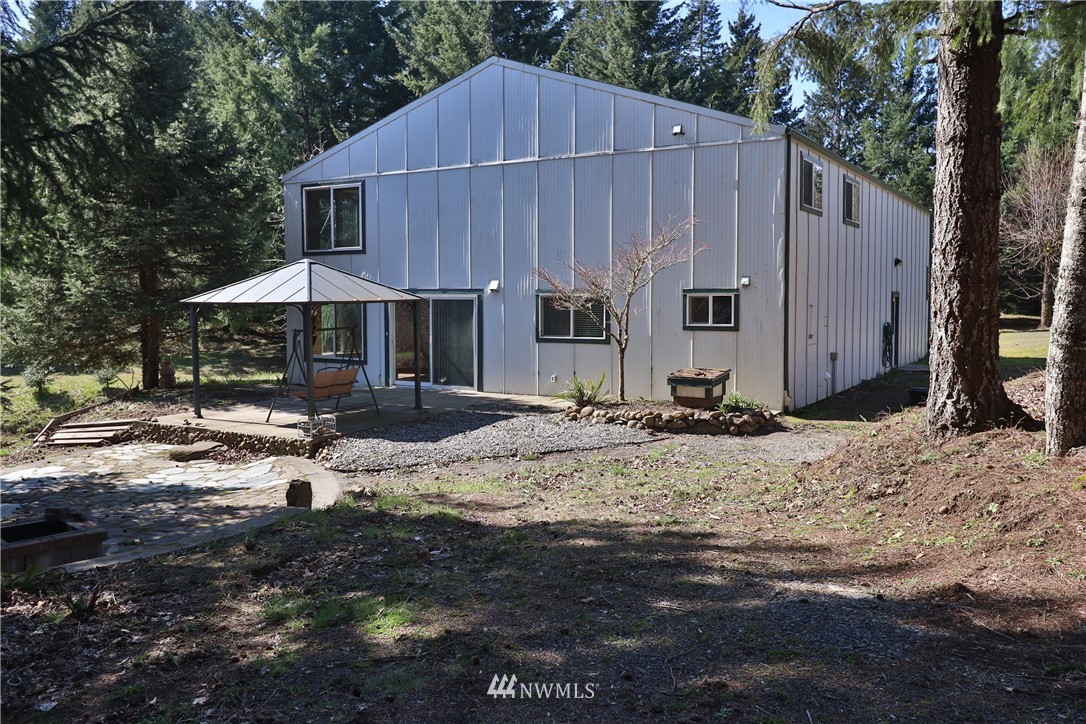 51 Quail Run Road Stevenson, WA 98648 - Photo 1 of 31 a view of a house with backyard and trees